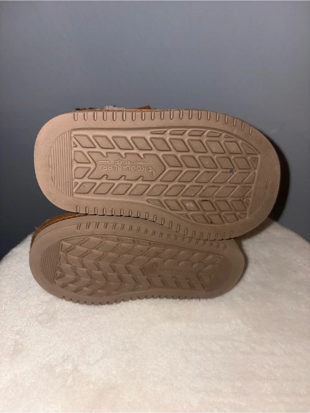 Pair of Cozy Suede toddler boots in Chestnut kookaburra by Ugg and Black sued